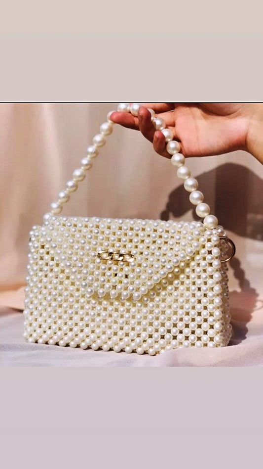 Elevate your style with the elegant Creamy Beaded Hand And Shoulder Bag