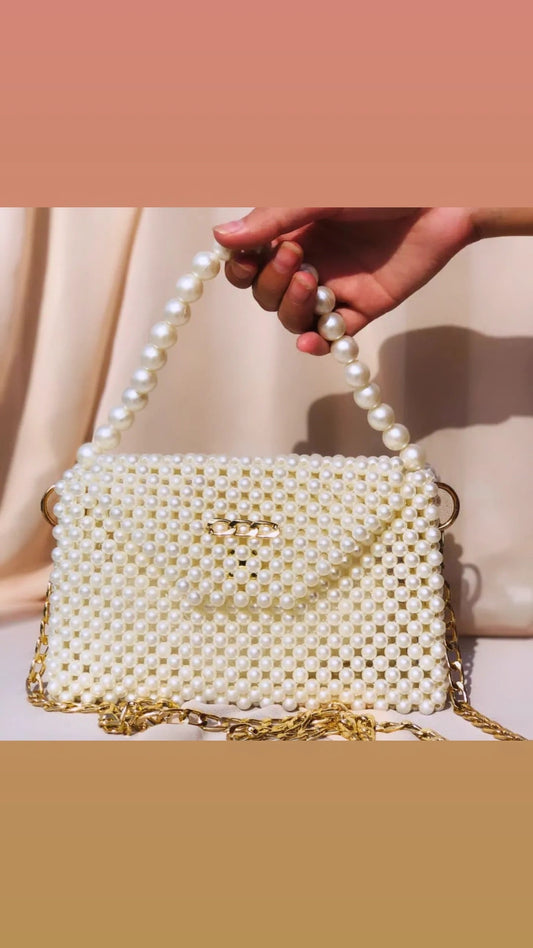 Elevate your style with the elegant Creamy Beaded Hand And Shoulder Bag